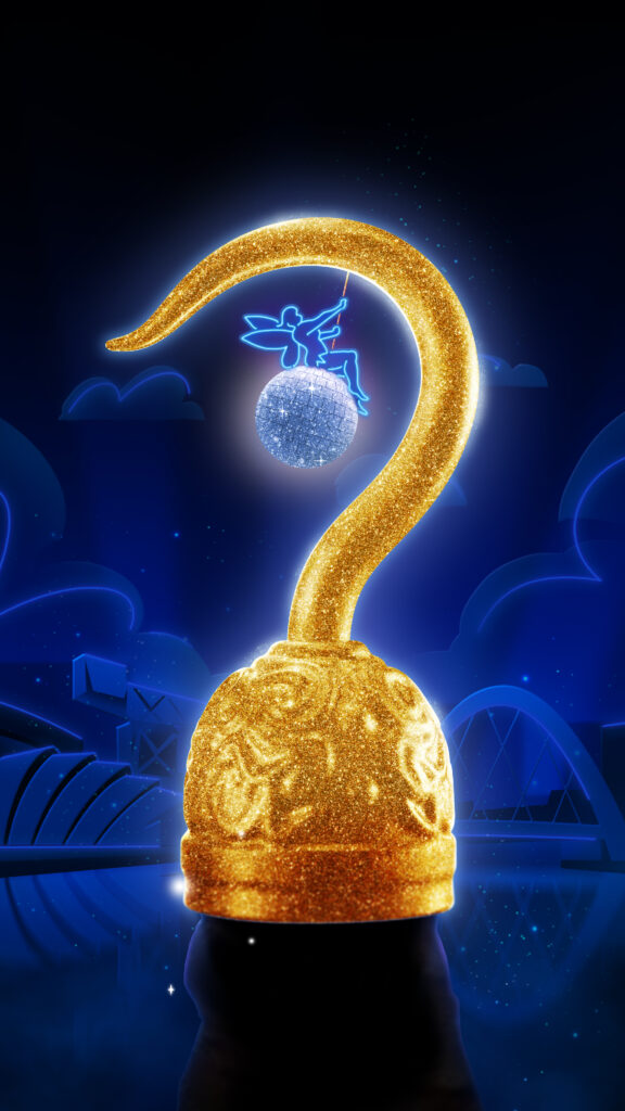 A large shiny gold hook dominates the foreground. A tiny neon fairy swings on a glitterball suspended from the hook. Iconic Glasgow buildings make up the subtle background.