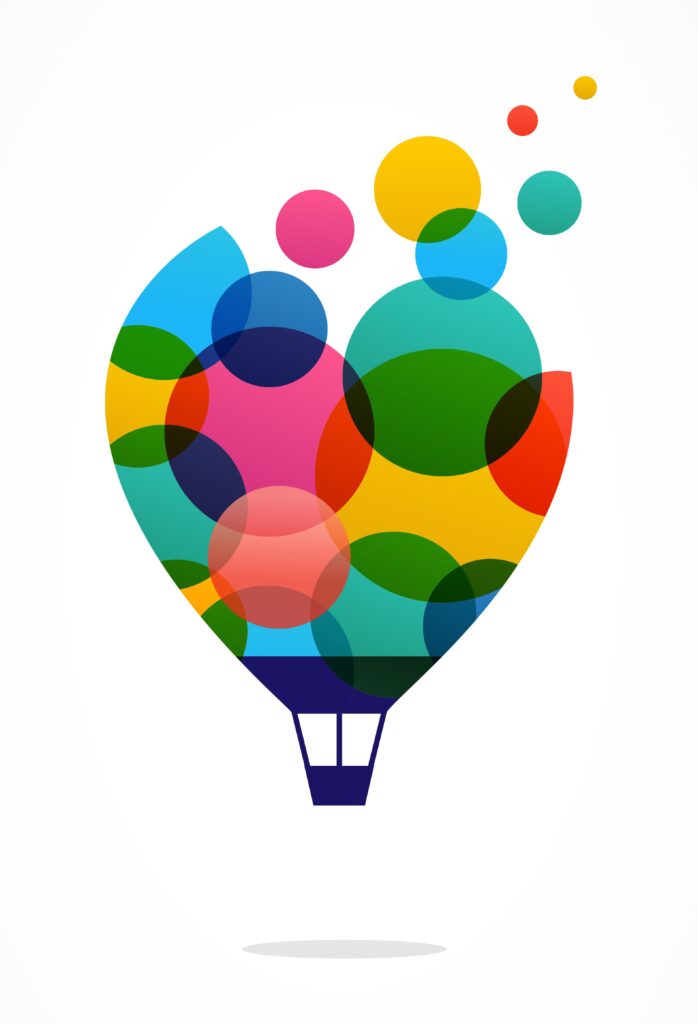 An illustration of a hot air balloon against a white background. The balloon itself is comprised of different-sized multi-coloured over-lapping circles. Six of these circles have broken free of the illustration edge and float up and off to the right. The balloon casts a grey shadow on the ground below.